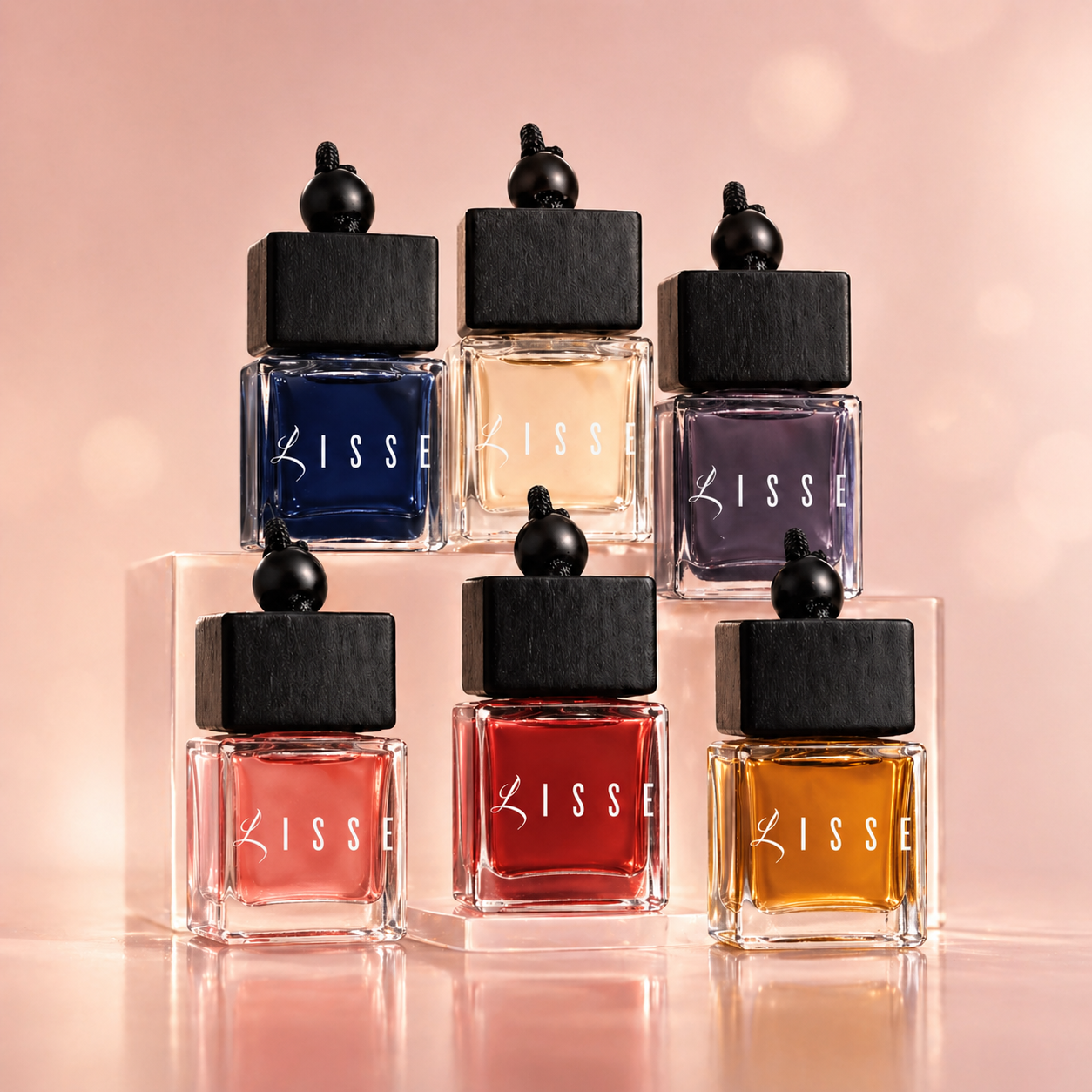 Lisse Good Girl car perfume: square glass bottle with black wood lid next to a blue stiletto-shaped bottle. Designer-inspired car fragrance.