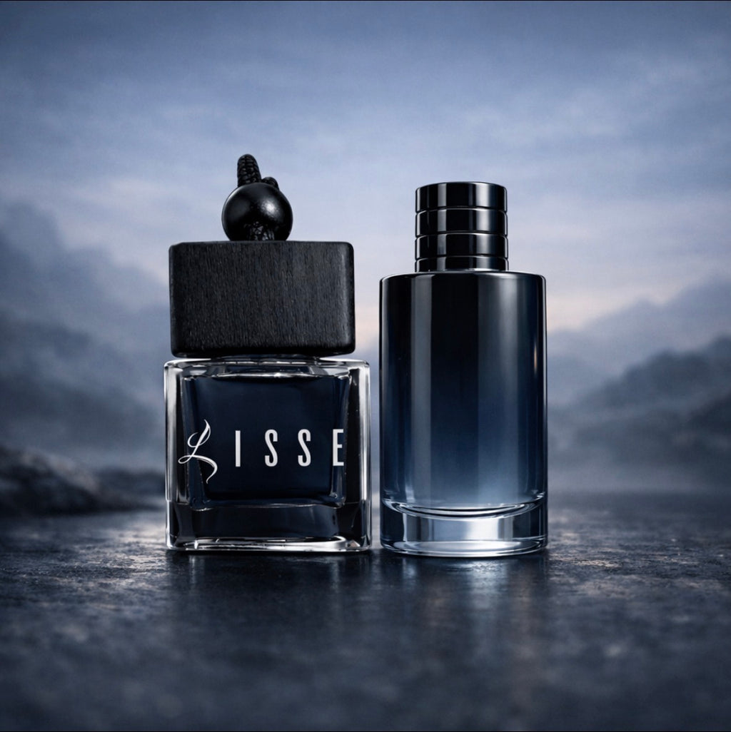 Lisse Born In Roma car scent: square wood-capped bottle beside a dark blue cylinder designer bottle. Luxury car air freshener on a dark and moody background.