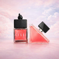 Lisse Paradoxe car fragrance: square wood-cap bottle paired with a pink triangle shaped designer bottle. Premium car air freshener.