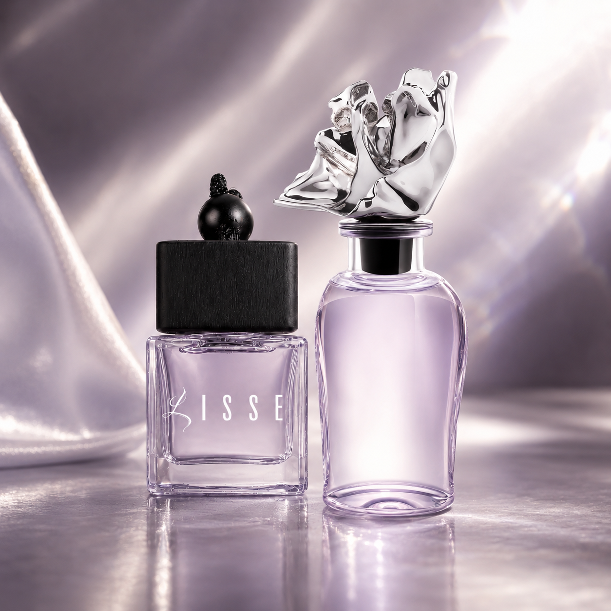 Two perfume bottles from Lisse: a smaller square glass bottle with a black cap and the word LISSE on the front, and a larger clear bottle with a sculptural silver rose-shaped cap, both set against a shimmering lavender satin background.